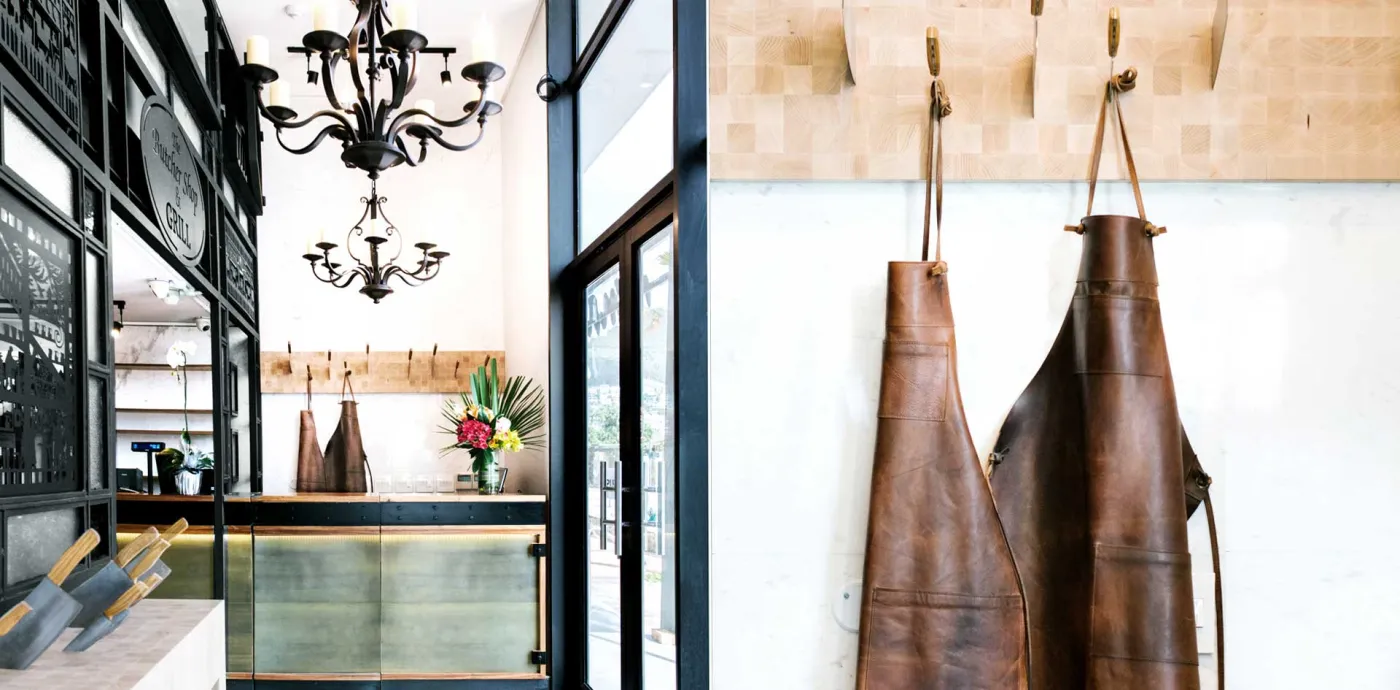 Leather butcher's aprons hanging at the entrance
