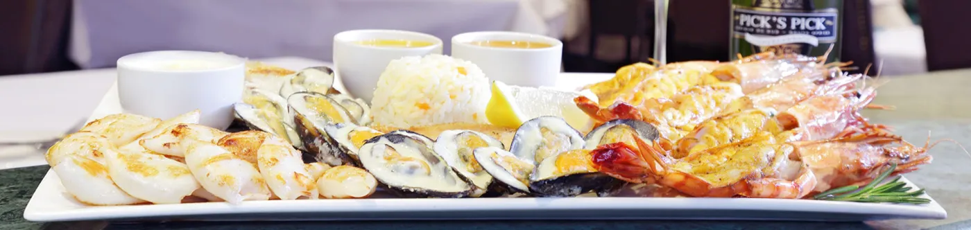 A seafood platter of prawns, oysters and calamari