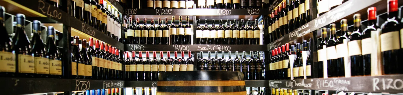 Racks of wine bottles with chalked prices